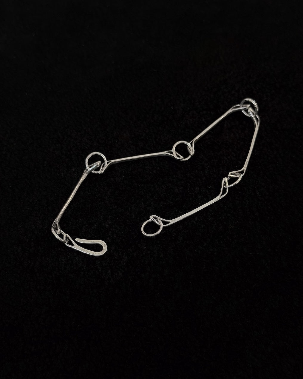 Minimalist 925 sterling silver bracelet inspired by the jawbone of a horse