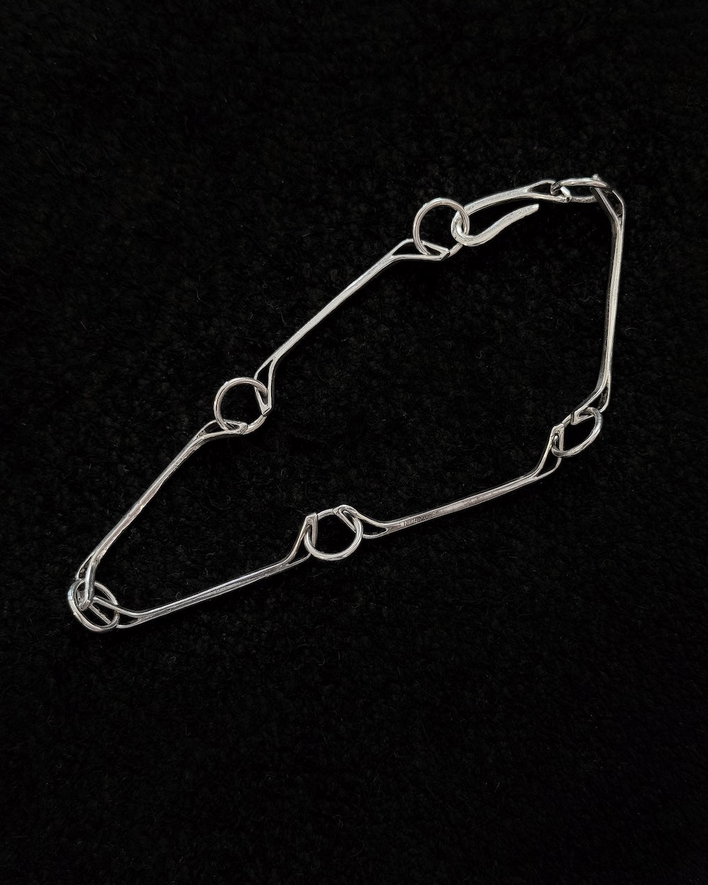Minimalist 925 sterling silver bracelet inspired by the jawbone of a horse