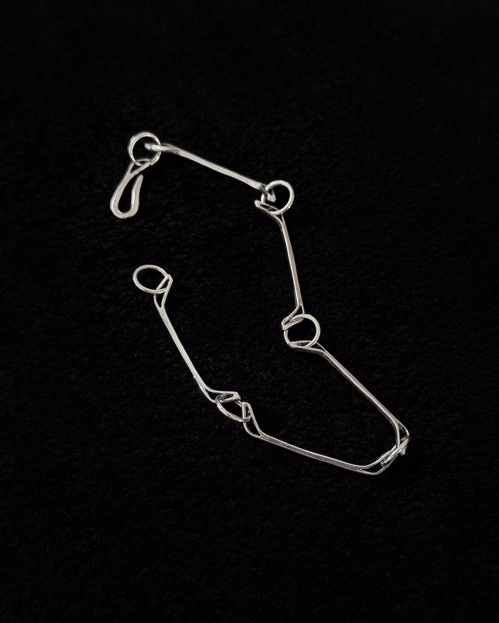 Minimalist 925 sterling silver bracelet inspired by the jawbone of a horse