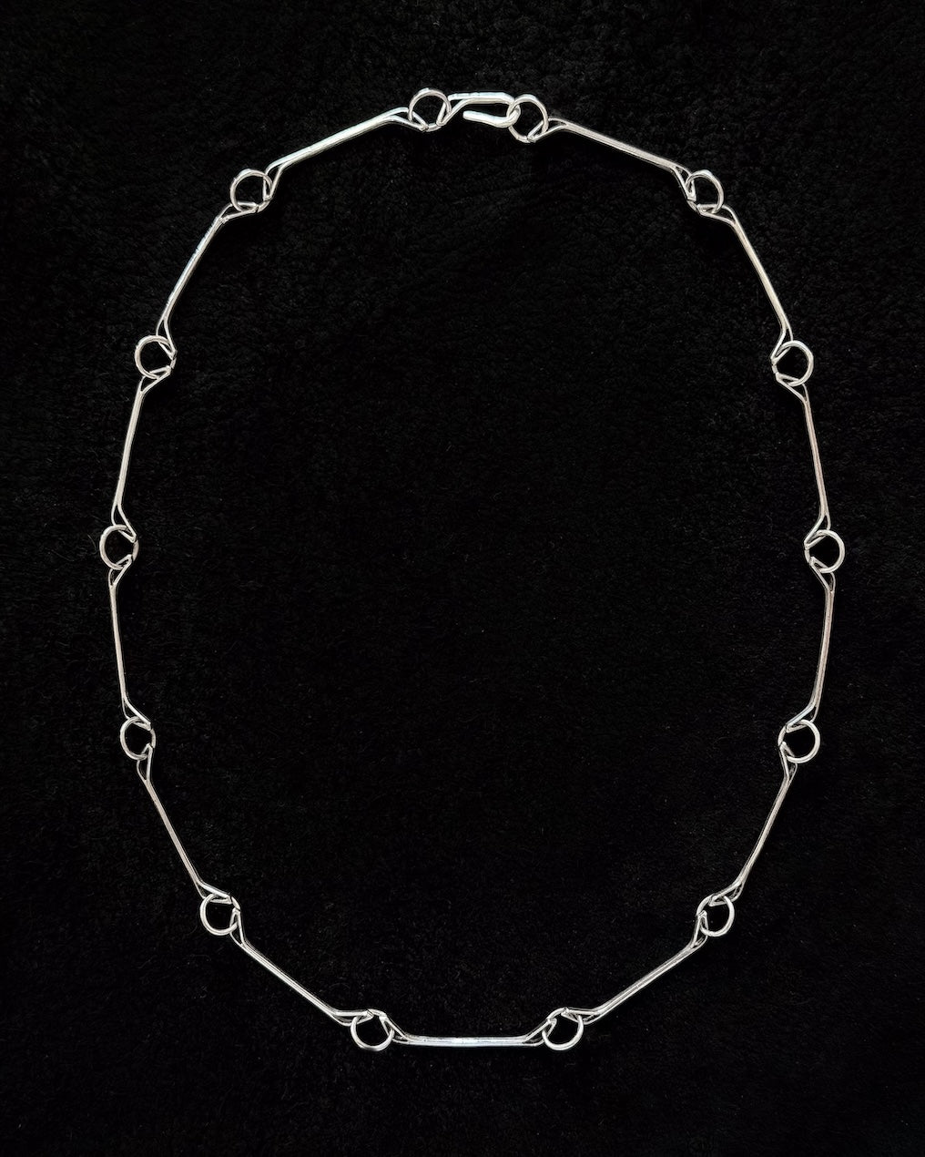 Minimalist 925 sterling silver necklace inspired by the jawbone of a horse