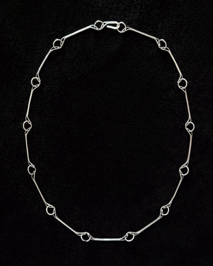 Minimalist 925 sterling silver necklace inspired by the jawbone of a horse