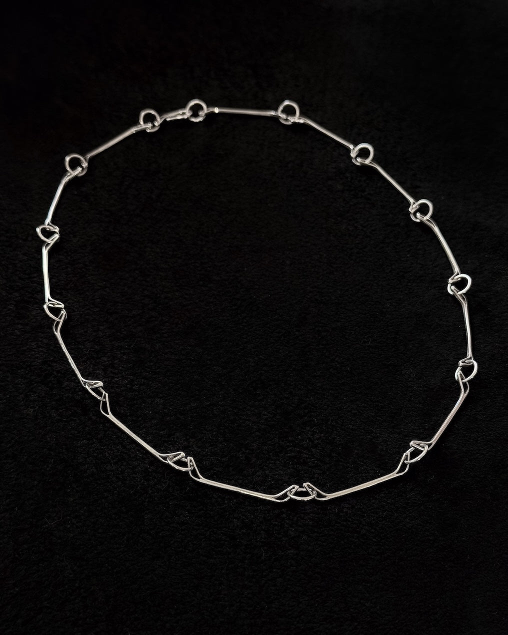 Minimalist 925 sterling silver necklace inspired by the jawbone of a horse