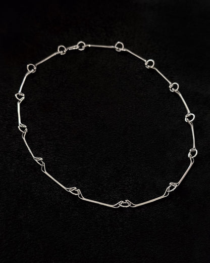 Minimalist 925 sterling silver necklace inspired by the jawbone of a horse