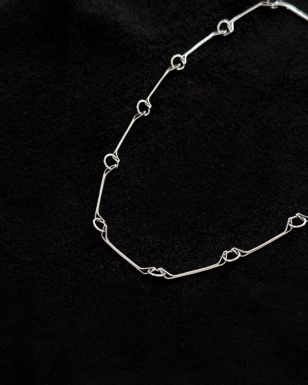 Minimalist 925 sterling silver necklace inspired by the jawbone of a horse