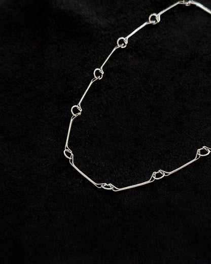 Minimalist 925 sterling silver necklace inspired by the jawbone of a horse