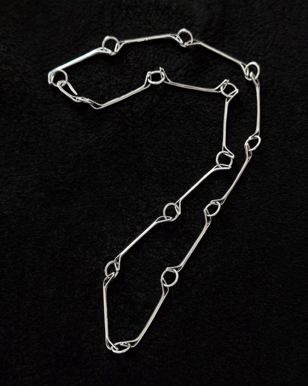 Minimalist 925 sterling silver necklace inspired by the jawbone of a horse