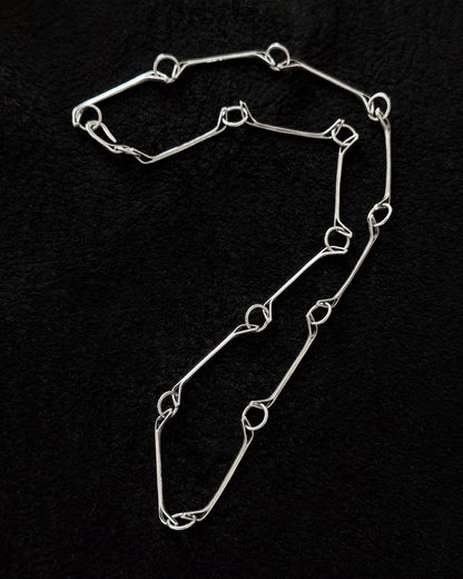Minimalist 925 sterling silver necklace inspired by the jawbone of a horse